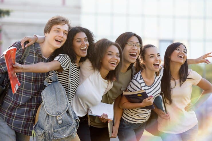 Multiethnic students standing together outdoors