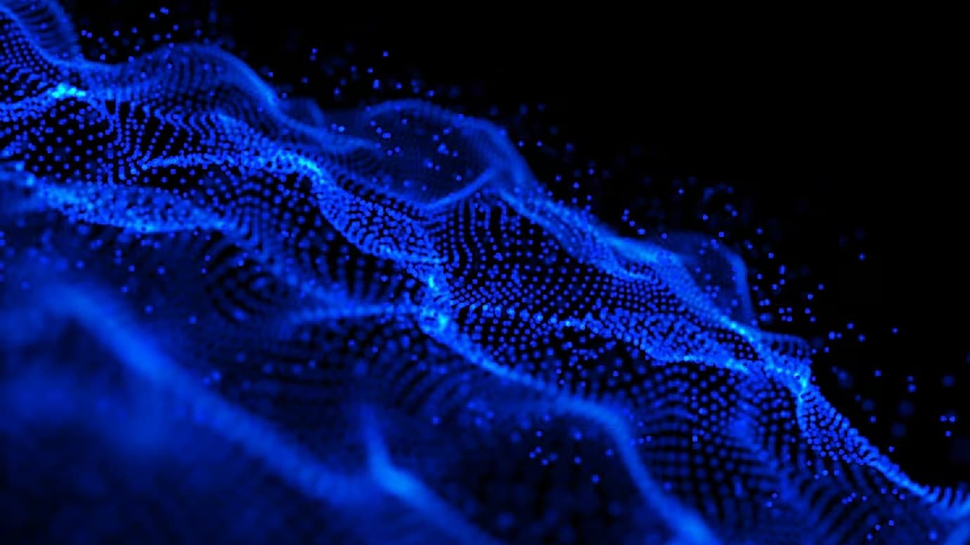 Blue particle wave flowing across a dark abstract background